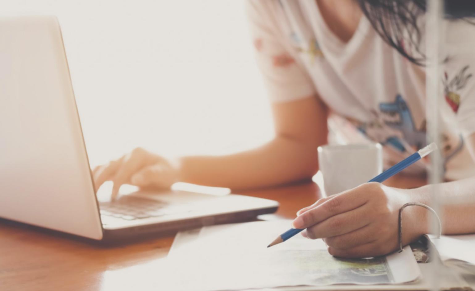 Student conducting financial research using multiple data sources and analytical tools